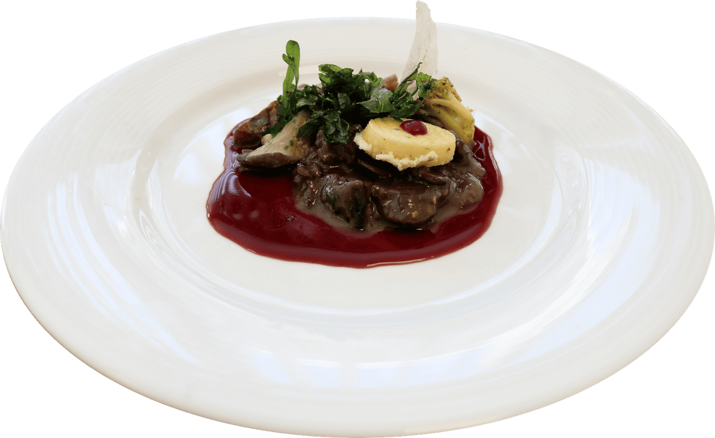 Gésiers de canard, polenta et roquette sur une réduction de vin cassis aux girofles